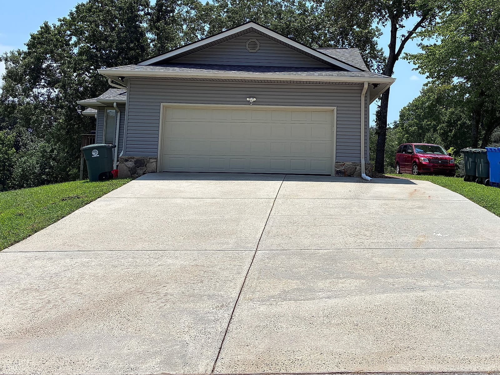 Bright, spotless two-car driveway after pressure washing